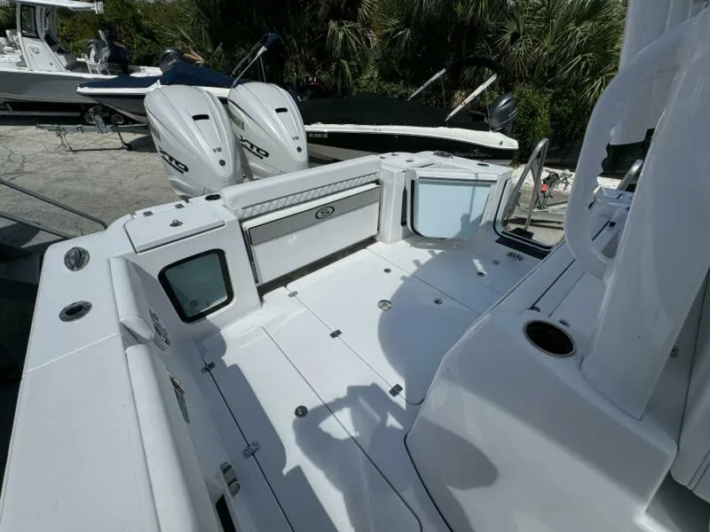 Slide: The Image of 2025 Sportsman 322 Open boat deck with twin Yamaha V8 engines. - 11
