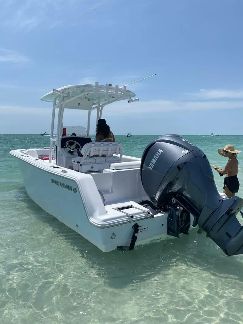 Slide: The Image of 2022 Sportsman 232 Open boat with Yamaha engine in clear blue water. - 5