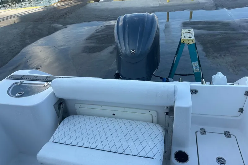 Slide: The Image of 2022 Sportsman Open 232 Center Console boat with Yamaha outboard motor at dock. - 11