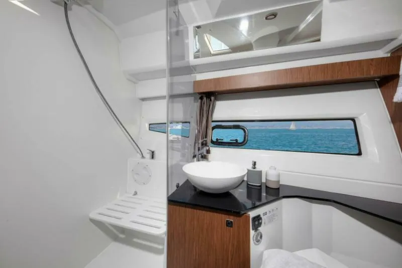Slide: The Image of Modern bathroom interior of 2025 Jeanneau NC 1095 Fly yacht with ocean view. - 12