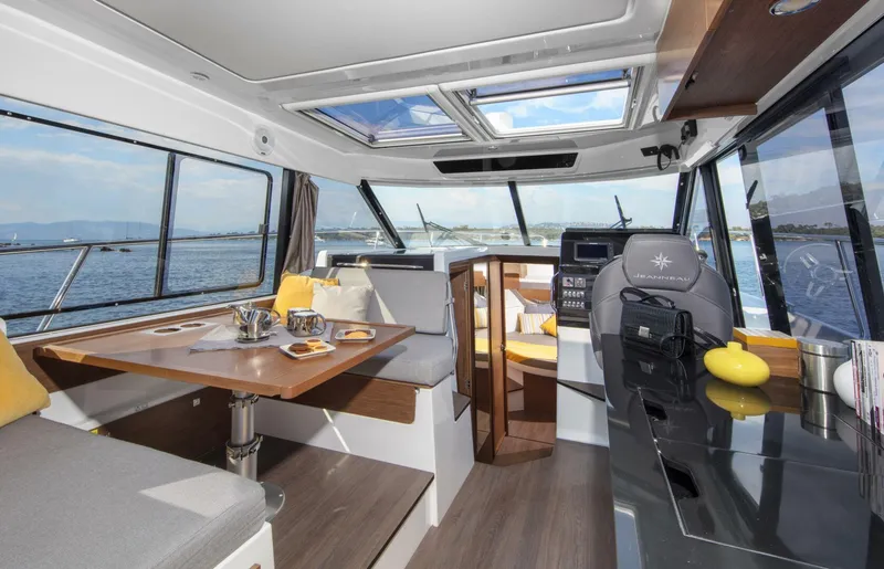 Slide: The Image of Interior of 2025 Jeanneau NC 1095 Fly yacht with dining area and helm station. - 4