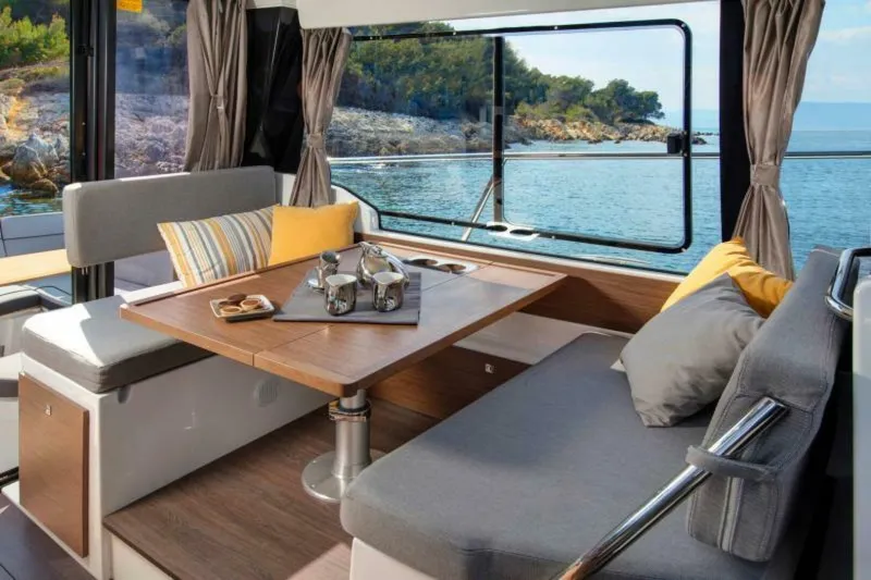 Slide: The Image of Luxurious interior of 2025 Jeanneau NC 1095 Fly yacht with scenic ocean view. - 6