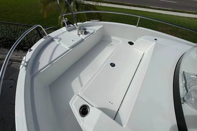 Slide: The Image of 2025 Jeanneau NC 795 SPORT S2 boat deck with sleek design and stainless steel railings. - 7