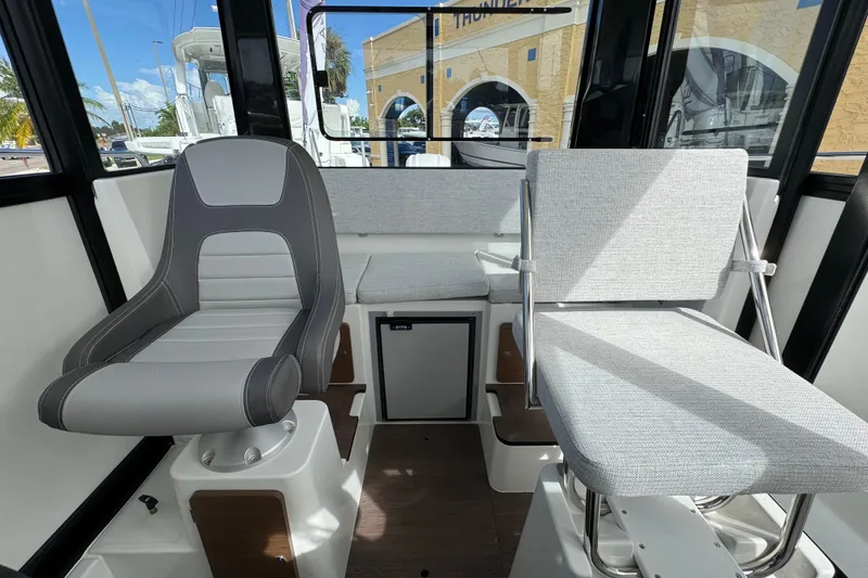 Slide: The Image of Interior of 2025 Jeanneau NC 795 SPORT S2 boat with modern seating and sleek design. - 9
