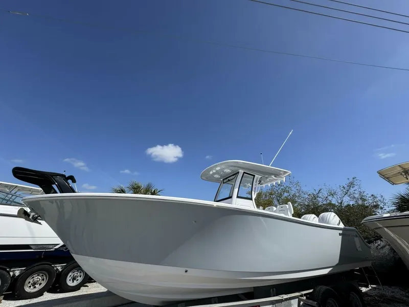 The Image of 2025 Sportsman 252 Open boat under clear blue sky, side view. - 0