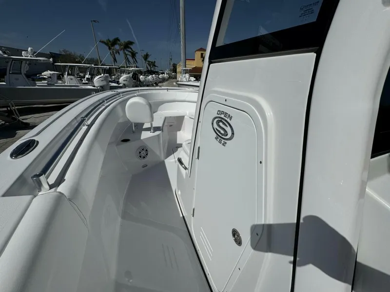 Slide: The Image of 2025 Sportsman 252 Open boat interior with sleek white design and modern features. - 12