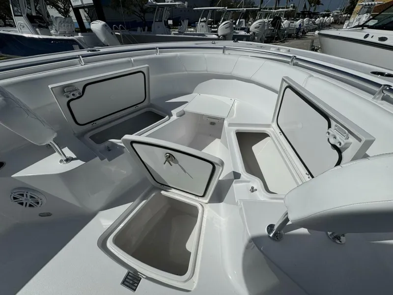 Slide: The Image of 2025 Sportsman 252 Open boat with open storage compartments and seating area. - 14