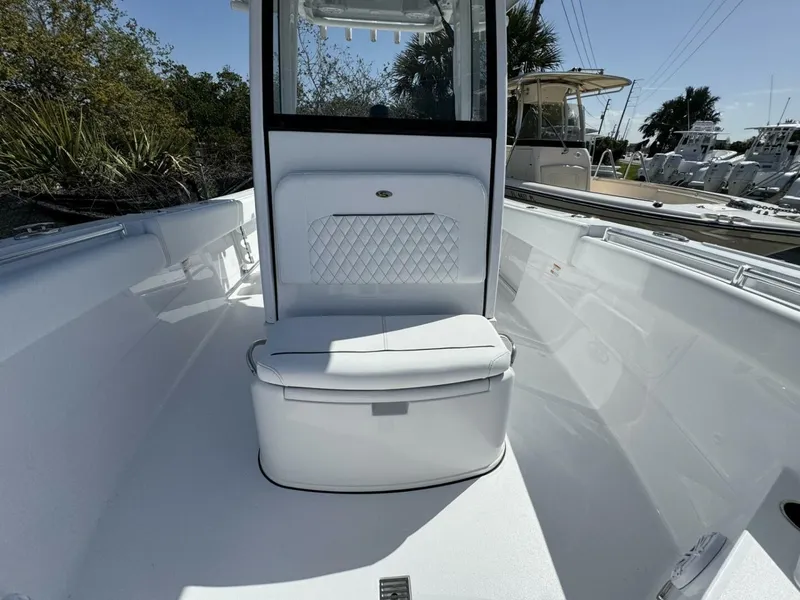 Slide: The Image of 2025 Sportsman 252 Open boat interior with white seating and sleek design. - 15