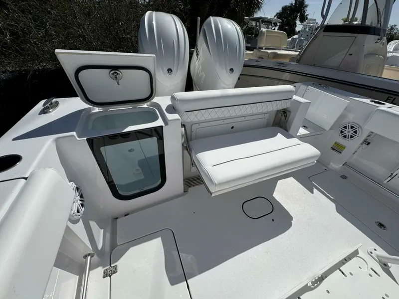 Slide: The Image of 2025 Sportsman 252 Open boat interior with seating and storage compartments. - 4