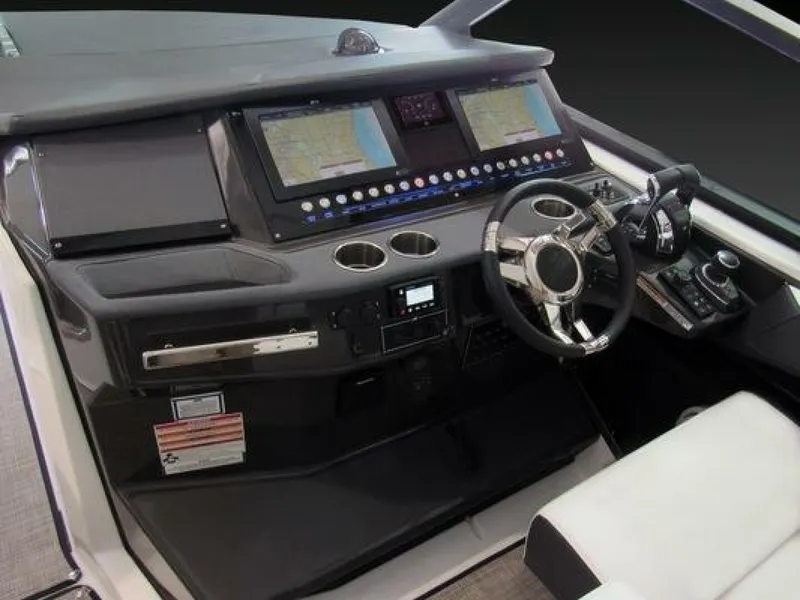 Slide: The Image of 2025 Monterey 385SS boat dashboard with advanced navigation screens and controls. - 4