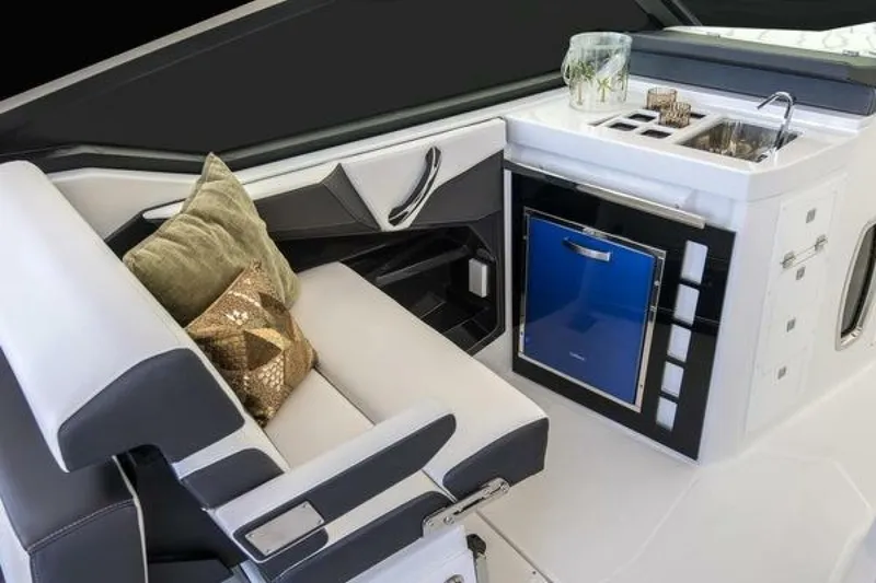 Slide: The Image of Luxurious interior of 2025 Monterey 385SS boat with seating and kitchenette. - 5