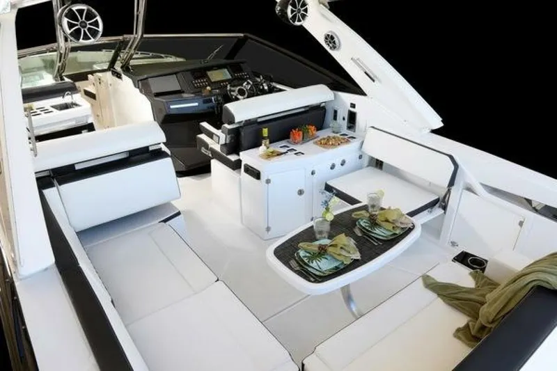 Slide: The Image of Luxurious interior of 2025 Monterey 385SS boat with elegant seating and dining area. - 6