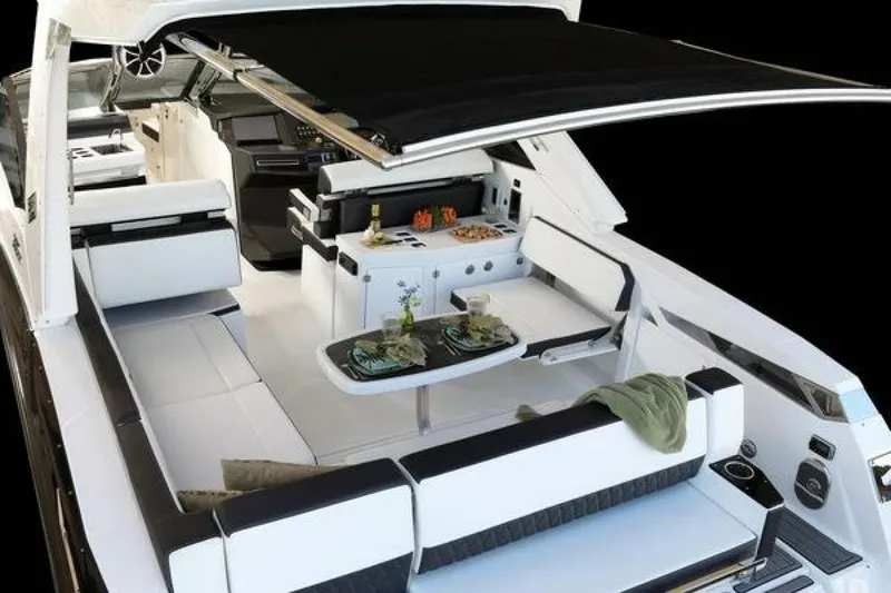Slide: The Image of 2025 Monterey 385SS luxury yacht interior with sleek seating and modern amenities. - 7