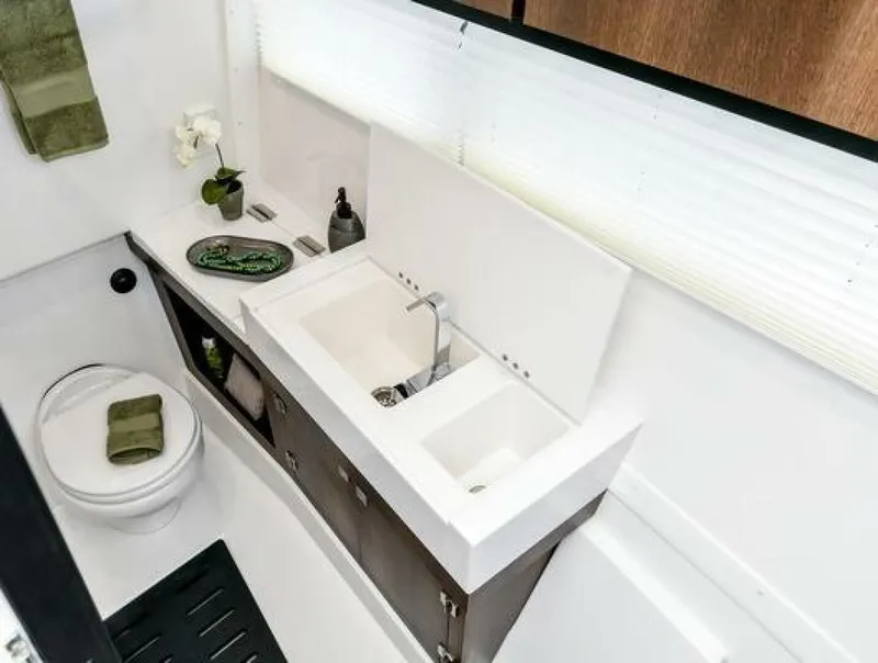 Slide: The Image of Luxurious bathroom interior of 2025 Monterey 385SS boat with modern sink and toilet. - 8