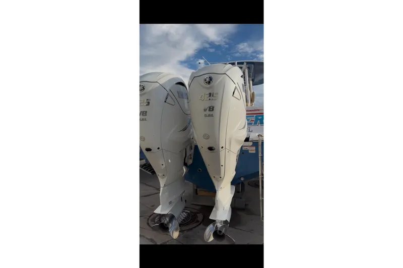 Slide: The Image of 2023 Sportsman Open 322 Center Console with twin Yamaha V8 outboard engines. - 28