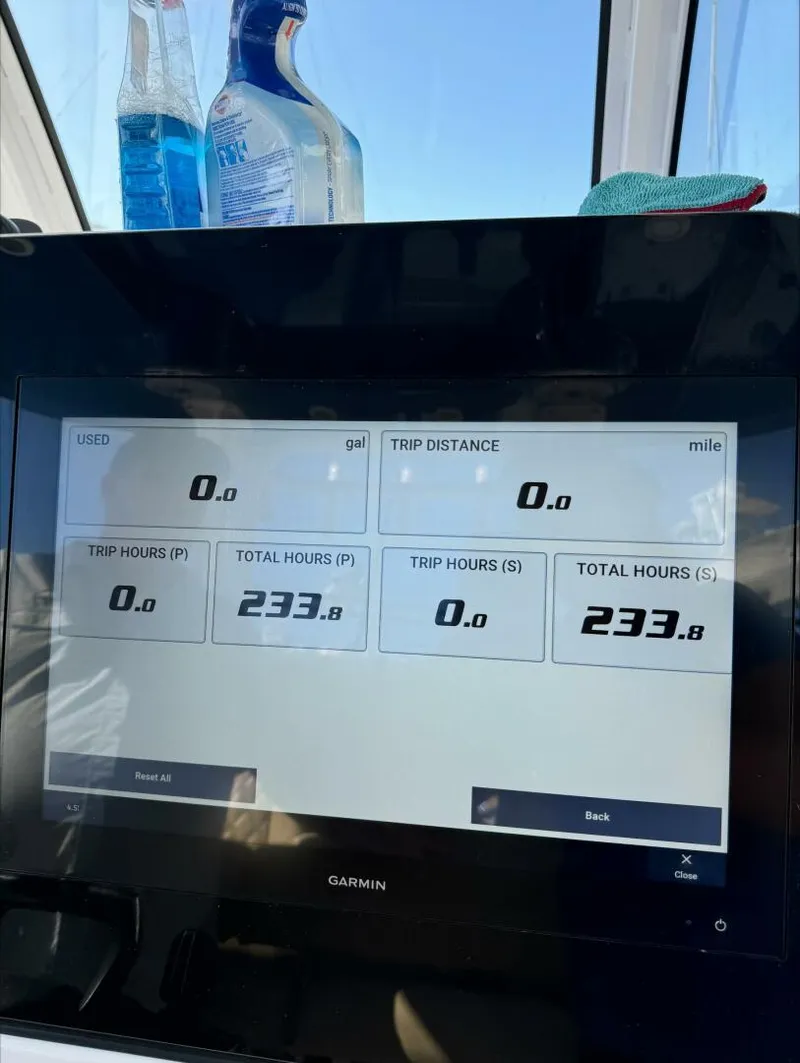 Slide: The Image of Garmin display showing trip data with zero usage and distance, 2023 Sportsman model. - 5