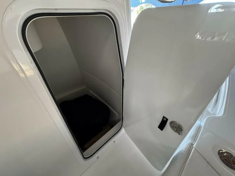 Slide: The Image of Open storage compartment on 2025 Regulator 24 XO boat. - 11