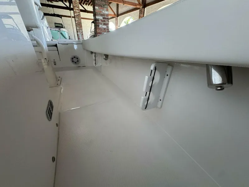 Slide: The Image of 2025 Regulator 24 XO boat interior, showcasing sleek white design and modern features. - 16