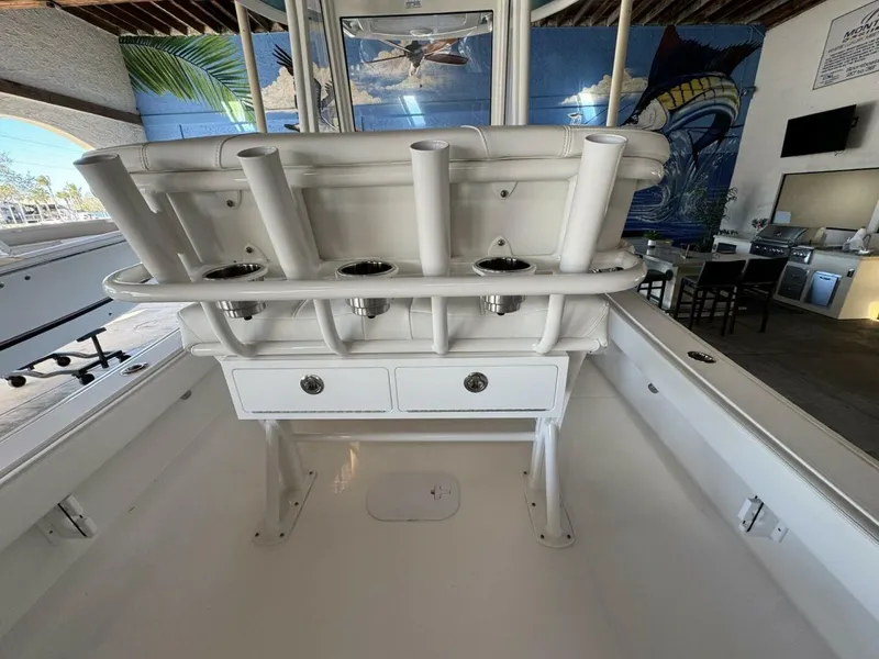 Slide: The Image of 2025 Regulator 24 XO boat interior with rod holders and storage drawers. - 7