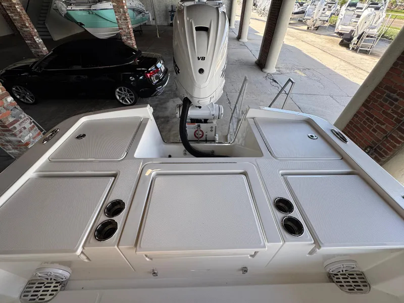 Slide: The Image of 2025 Regulator 26XO boat with V8 engine, docked in a marina. - 4