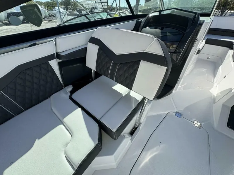 Slide: The Image of 2024 Monterey 255SS boat interior with modern seating and sleek design. - 12
