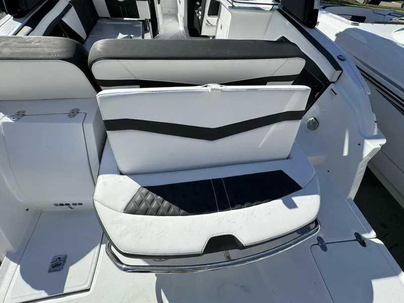 Slide: The Image of 2024 Monterey 255SS boat interior with black and white seating. - 7