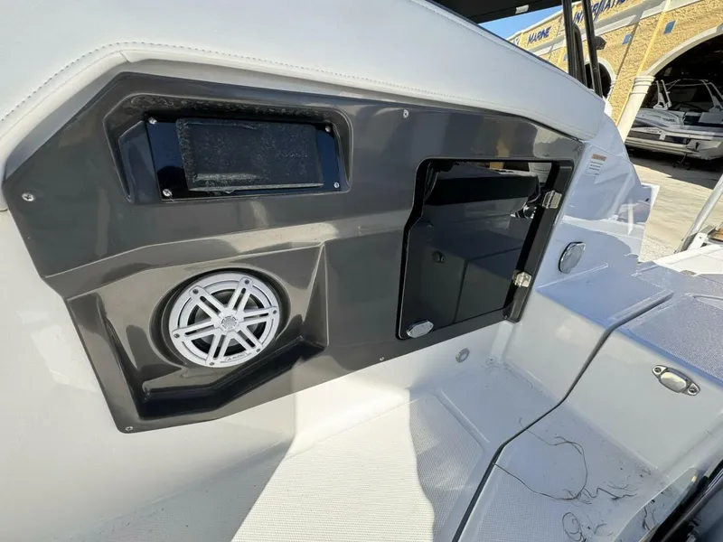Slide: The Image of 2024 Monterey 255SS boat interior with speaker and storage compartment. - 8