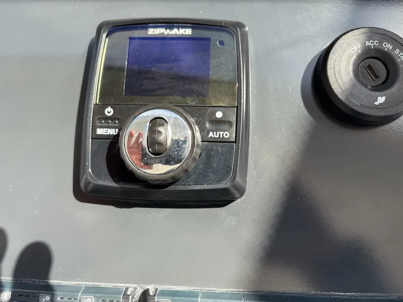 Slide: The Image of Control panel on 2024 Jeanneau DB43 boat dashboard with Zipwake system. - 14