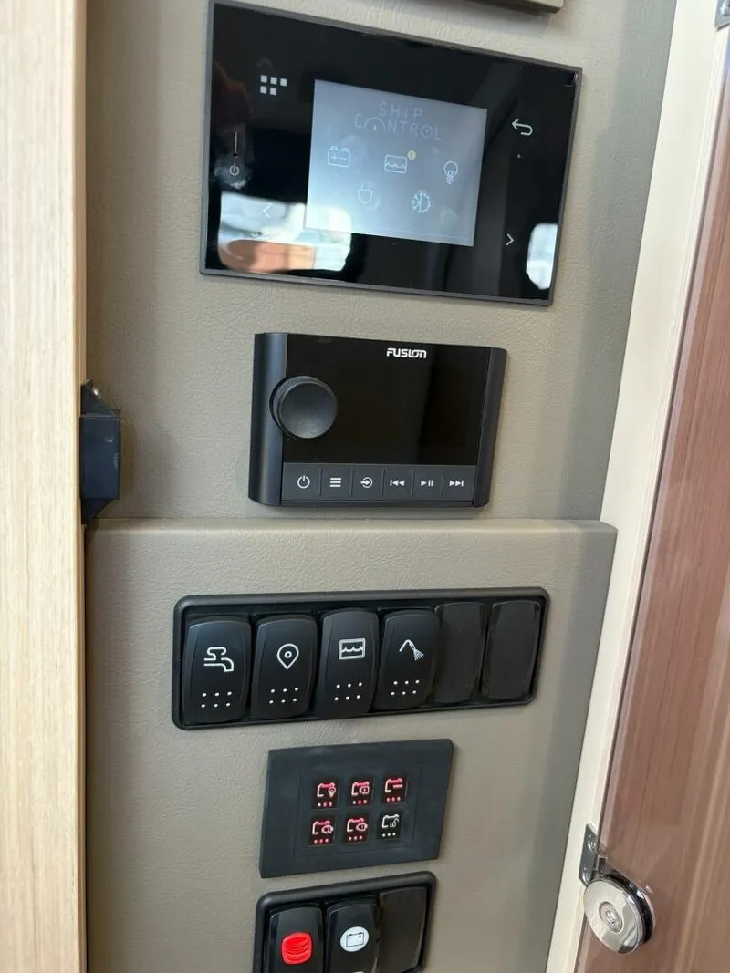 Slide: The Image of Control panel of 2024 Jeanneau DB43 yacht with touchscreen and switches. - 20