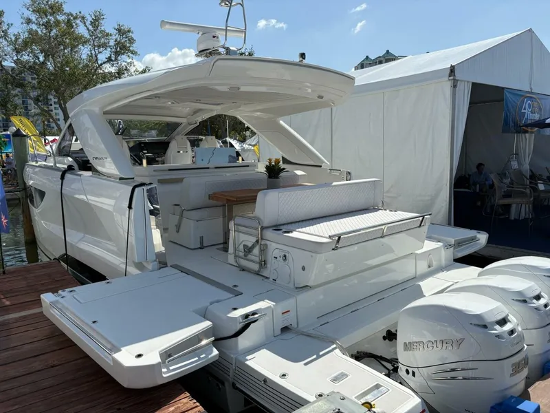 Slide: The Image of 2024 Jeanneau DB43 yacht with Mercury engines docked at a marina. - 4
