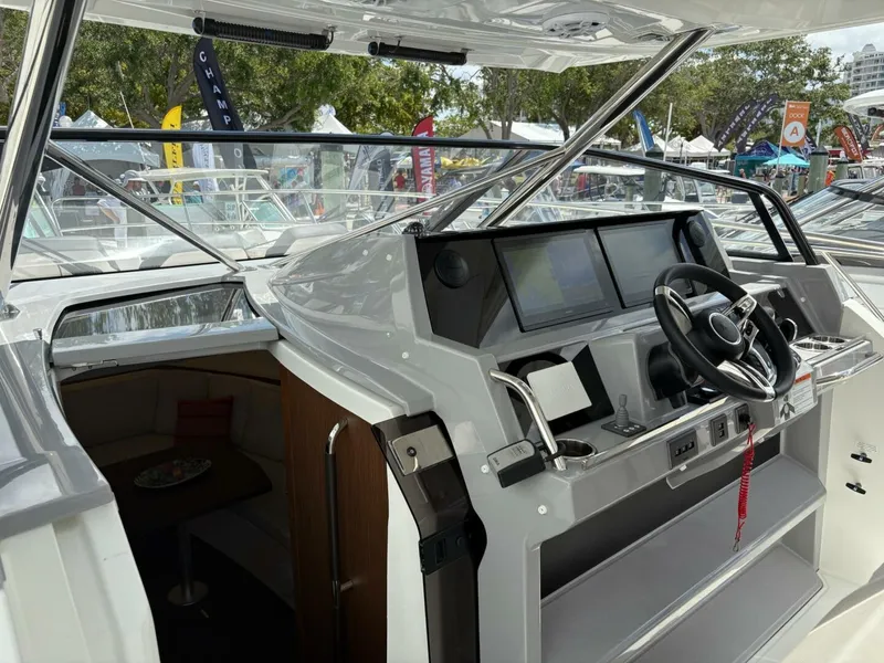 Slide: The Image of Luxurious interior of 2024 Jeanneau 12.5 Walk boat with modern seating and wood finish. - 10