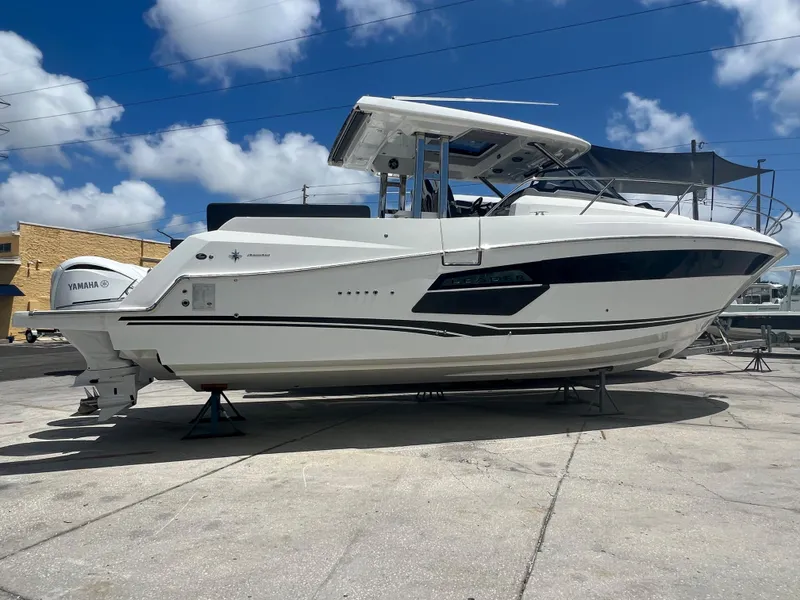Slide: The Image of 2024 Jeanneau 12.5 Walk boat deck with seating and modern design. - 3
