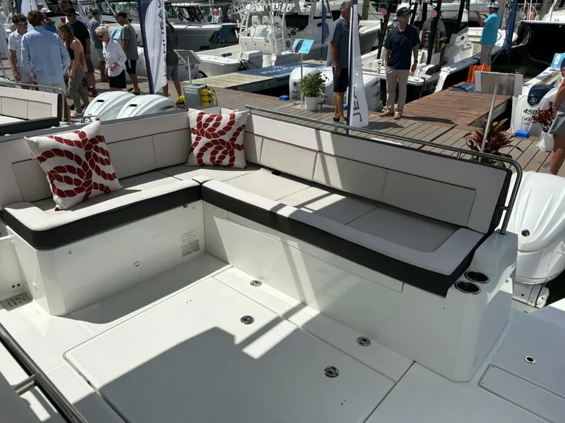 Slide: The Image of 2024 Jeanneau 12.5 Walk boat deck with safety railings and steps. - 5