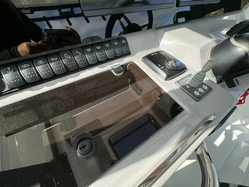 Slide: The Image of Control panel of 2024 Jeanneau 10.5 CC boat with switches and joystick. - 9