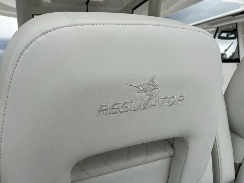 Slide: The Image of 2025 Regulator 30XO boat seat with embroidered logo, showcasing luxury marine craftsmanship. - 11
