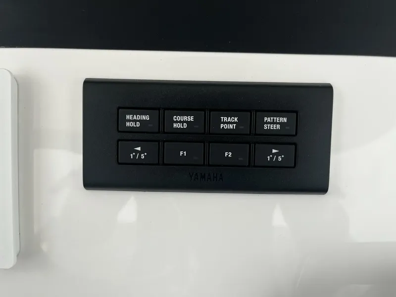 Slide: The Image of Control panel of a 2025 Regulator 30XO boat with Yamaha buttons. - 17