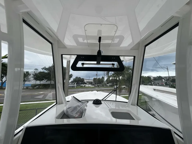 Slide: The Image of Interior view of 2025 Regulator 30XO boat cockpit with windshield and dashboard. - 20