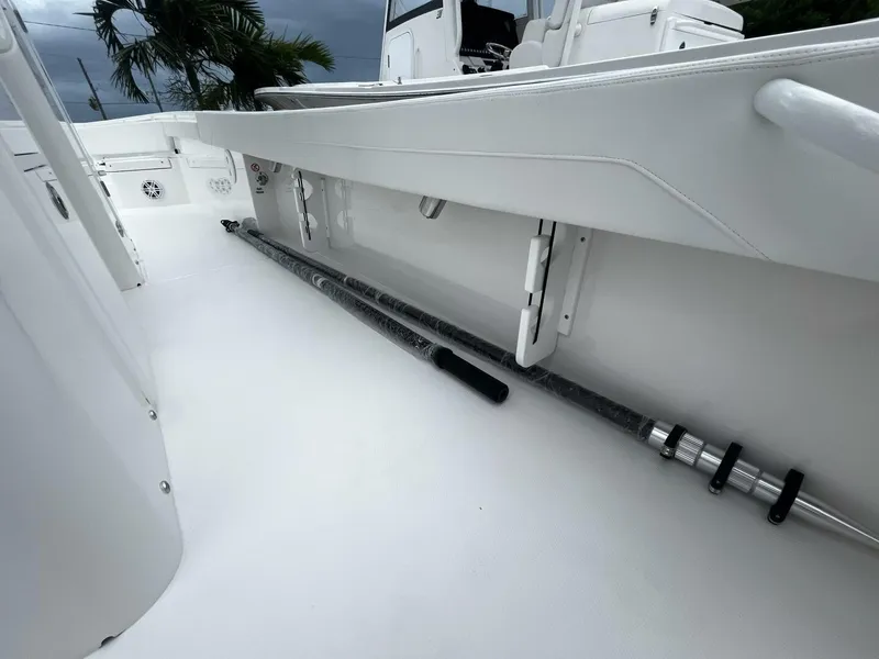 Slide: The Image of 2025 Regulator 30XO boat interior with fishing rod storage. - 22