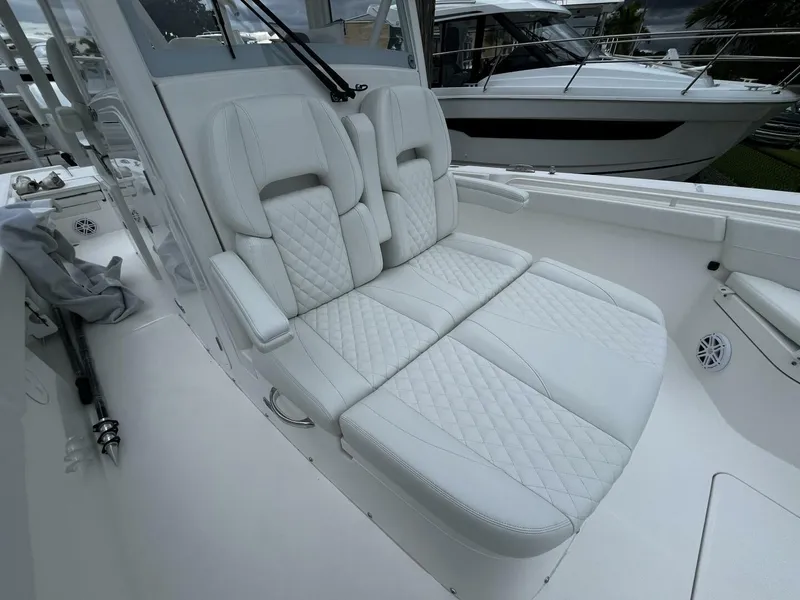 Slide: The Image of 2025 Regulator 30XO boat with luxurious white quilted seating. - 24