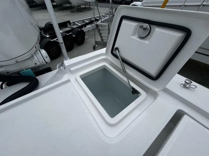 Slide: The Image of Open storage compartment on 2025 Regulator 30XO boat, showcasing interior space. - 6