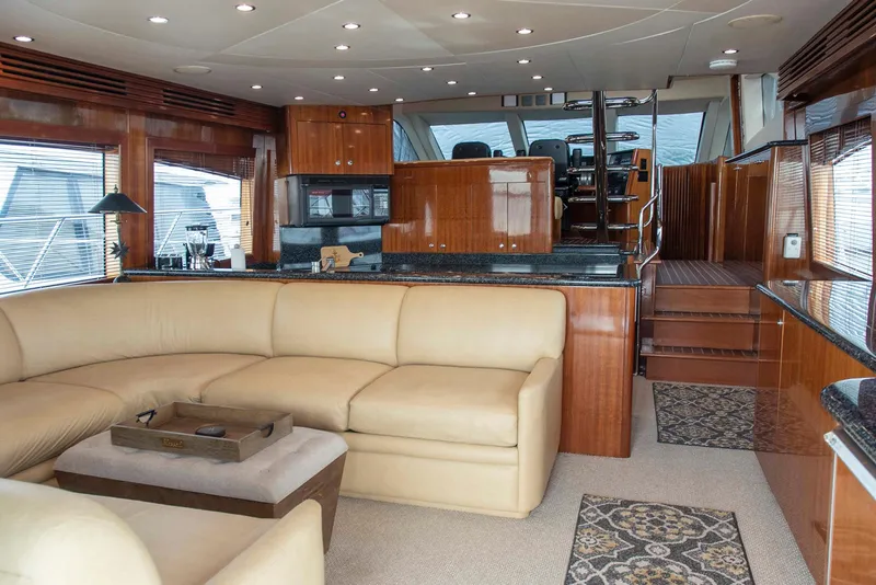 Slide: The Image of Luxurious interior of 2002 Hatteras 63 Raised Pilothouse Motor Yacht with leather seating and wood finishes. - 11