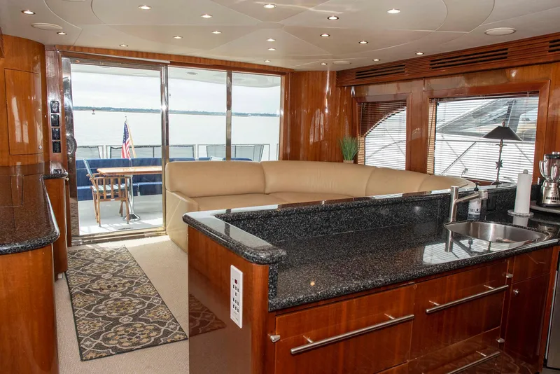 Slide: The Image of Luxurious interior of 2002 Hatteras 63 Raised Pilothouse Motor Yacht with elegant wood finishes. - 12