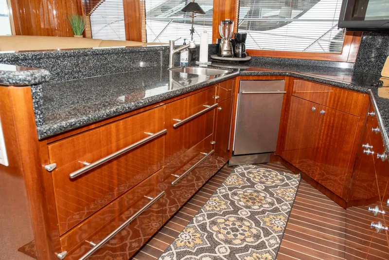 Slide: The Image of Luxurious kitchen in 2002 Hatteras 63 Raised Pilothouse Motor Yacht with granite countertops. - 13