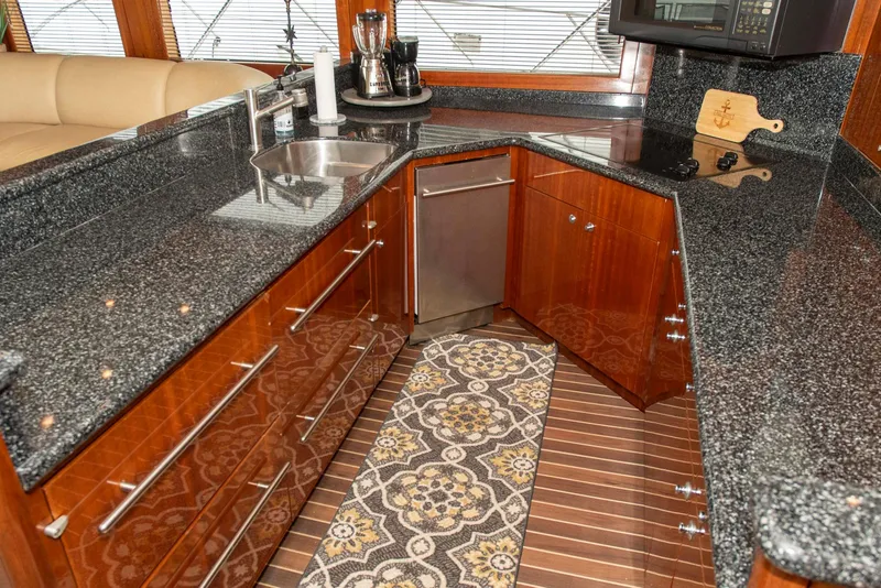 Slide: The Image of Luxurious kitchen in 2002 Hatteras 63 Raised Pilothouse Motor Yacht with granite countertops. - 16