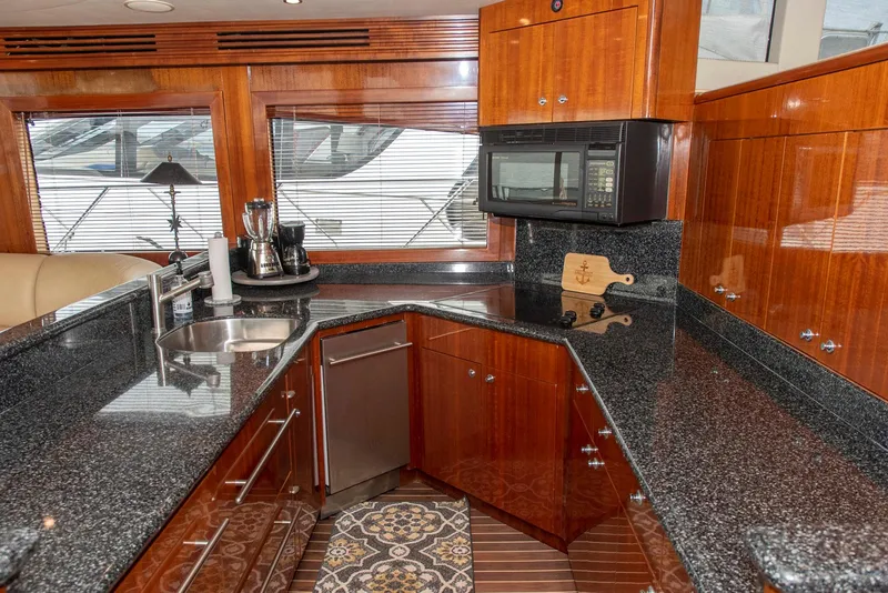 Slide: The Image of Luxurious kitchen in 2002 Hatteras 63 Raised Pilothouse Motor Yacht with granite countertops. - 17