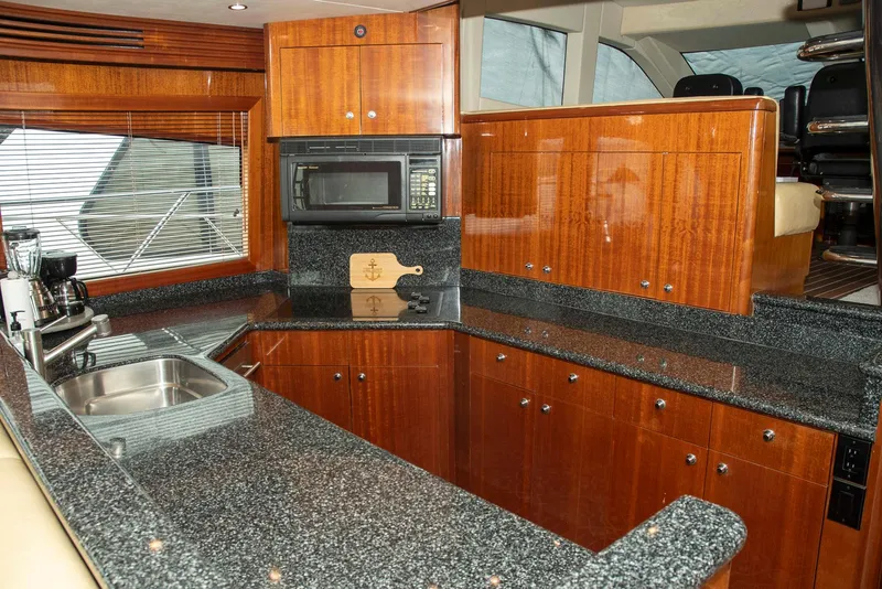Slide: The Image of Luxurious kitchen interior of 2002 Hatteras 63 Raised Pilothouse Motor Yacht. - 21
