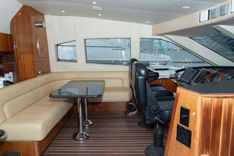 Slide: The Image of Luxurious interior of 2002 Hatteras 63 Raised Pilothouse Motor Yacht with seating and helm. - 27