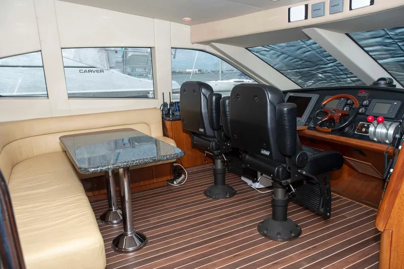Slide: The Image of Interior of 2002 Hatteras 63 Raised Pilothouse Motor Yacht with seating and helm. - 28
