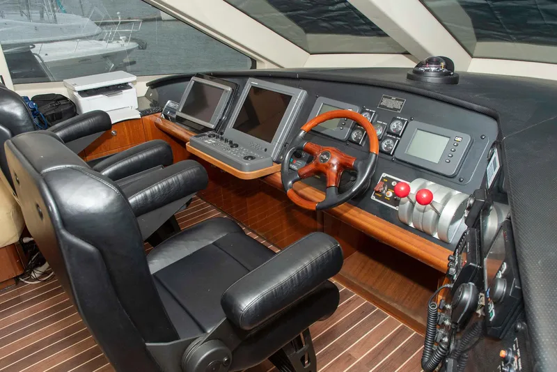 Slide: The Image of Pilothouse interior of 2002 Hatteras 63 Raised Pilothouse Motor Yacht with navigation equipment. - 31
