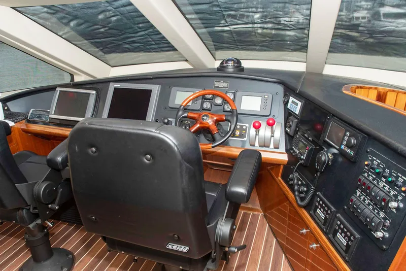 Slide: The Image of Pilothouse interior of 2002 Hatteras 63 Raised Pilothouse Motor Yacht with navigation controls. - 32